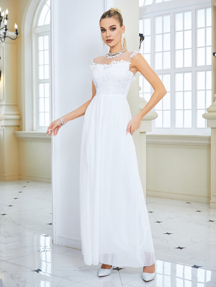 This wedding dress is a timelessly beautiful statement piece. Masterful craftsmanship and exquisite lace bring to life a sleek silhouette with a delicate chiffon backless feature that is sure to captivate. Elegance, style, and sophistication come together in this dreamy gown.