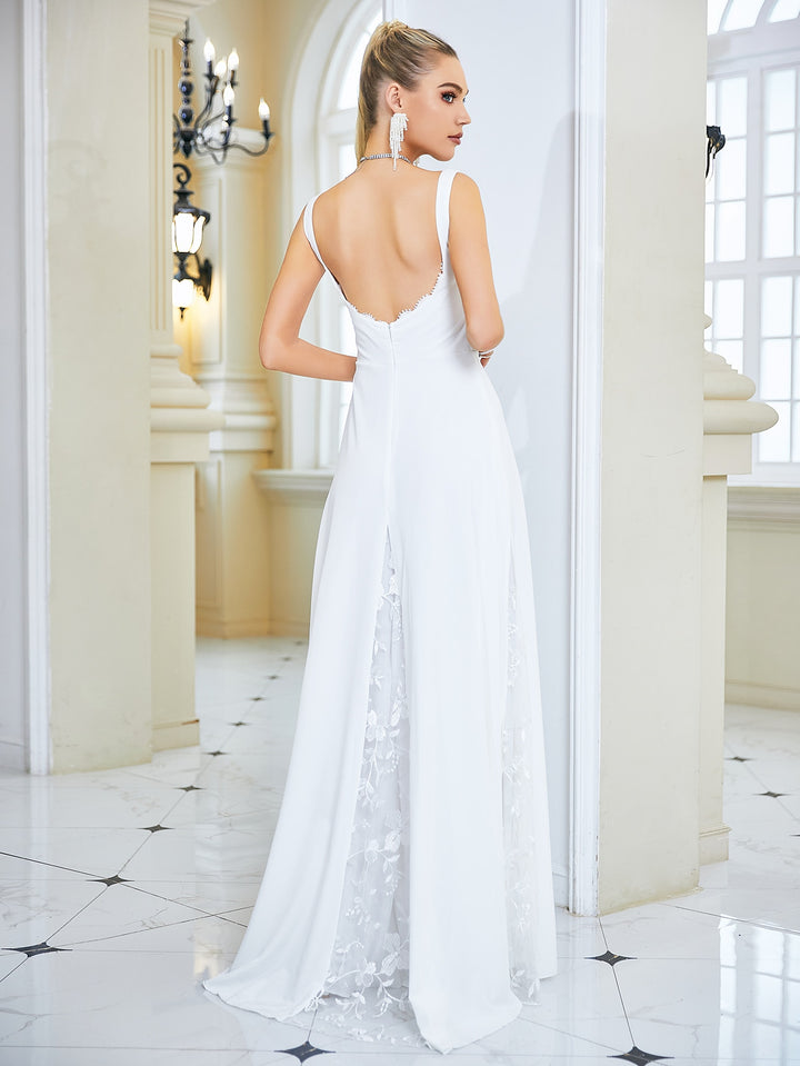 Feel daring and on-trend in this gorgeous backless white lace wedding gown! Make jaws drop with its classic silhouette and feminine details. Show off your back in style and make your wedding day one to remember!